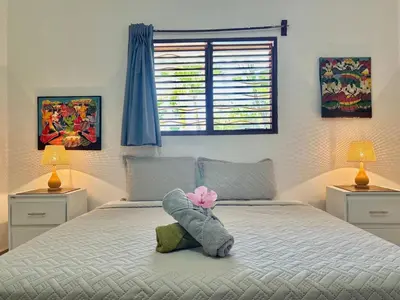 a bedroom with a bed with a stuffed animal on it at Hilltop Dominican Villa with Pool and Big Terrace in Las Terrenas