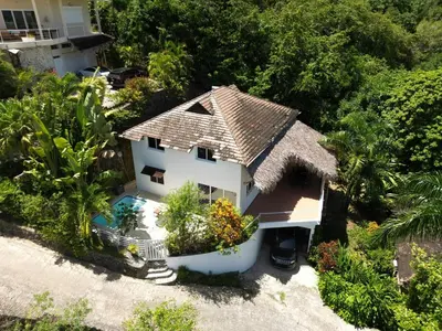 an aerial view of a house with a swimming pool at Hilltop Dominican Villa with Pool and Big Terrace in Las Terrenas