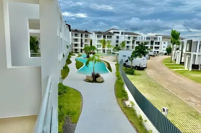 a view of the pool from the balcony of a resort at Garden Breeze 1 By Advantage Club