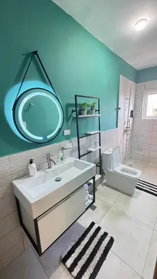a bathroom with a sink and a mirror and a toilet at WRparaiso in Boca Chica