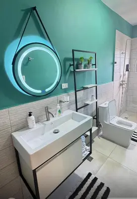 a bathroom with a sink and a mirror and a toilet at WRparaiso in Boca Chica