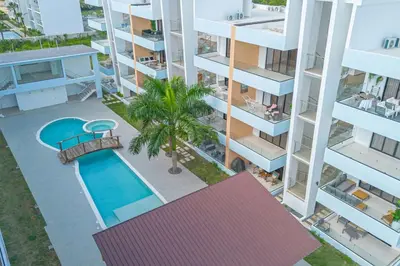 an aerial view of a apartment complex with a swimming pool at Caribbean Pearl 2BR Sunshine Bayahíbe in Bayahibe