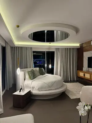 a bedroom with a large bed in a room at Villa Paraíso Casa de Campo in La Romana