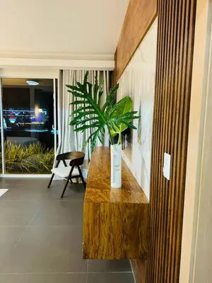a room with a wooden bench with a plant on it at Villa Paraíso Casa de Campo in La Romana