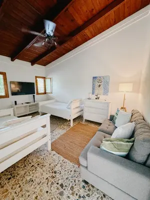 a living room with a couch and a table at Lux Villa Casa de Campo in La Romana