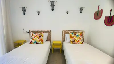 two beds in a room with skulls on the wall at Private Pool Villa With Parking in Las Terrenas