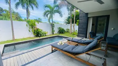 a swimming pool with a couch and a table at Private Pool Villa With Parking in Las Terrenas