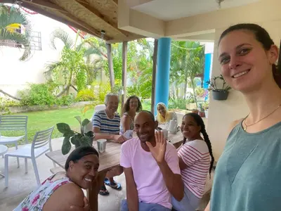 a group of people sitting around a table at the Count of Villa Rosa in La Ceiba