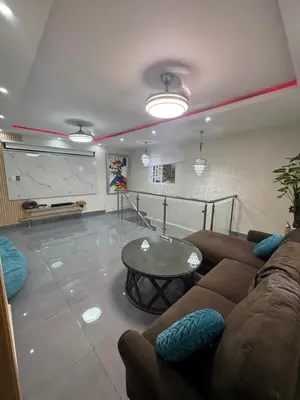 a living room with a couch and a table at Villa yaya 1 in Boca Chica