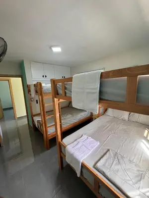 a room with two bunk beds in a house at Villa yaya 1 in Boca Chica