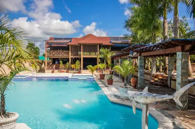 a swimming pool in front of a house at Blue Lagoon House RD