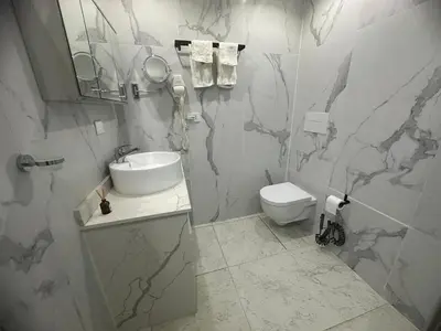 a bathroom with a sink and a toilet at Beachfront - Stunning View in Boca Chica