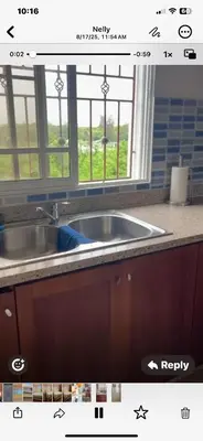 a kitchen counter with a sink and a window at Apartamento en Gribi in Juan Dolio