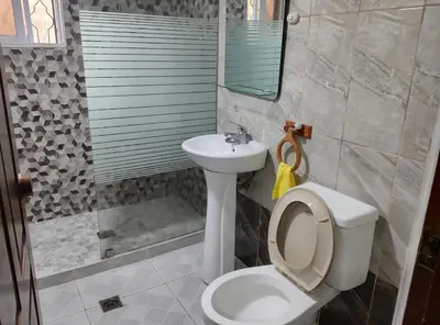 a bathroom with a toilet and a sink at Apart-Hotel Costa Verde in Costa Verde
