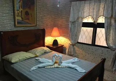 a bedroom with a bed with towels on it at Apart-Hotel Costa Verde in Costa Verde