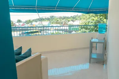 a view of a balcony with a blue canopy at Hotel cotubanama