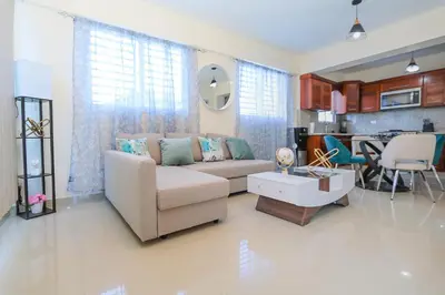 a living room with a couch and a table at Edificio Amber in San Cristóbal