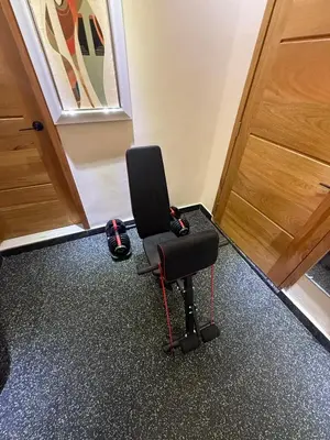 a black chair sitting in front of a door at private property just for you in San Isidro