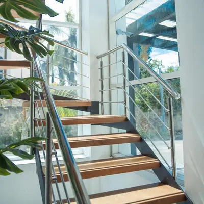 a spiral staircase in a house with a window at Crown 1 in Puerto Plata