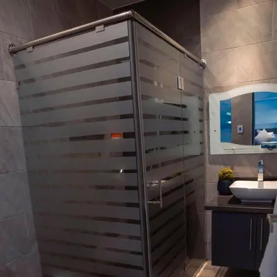 a bathroom with a shower and a sink at Crown 1 in Puerto Plata