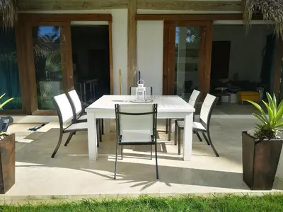 a white table and chairs on a patio at Beautiful Caribbean Villa Coson Beach in Las Terrenas