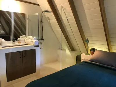 a bathroom with a shower and a bed and a sink at Beautiful Caribbean Villa Coson Beach in Las Terrenas