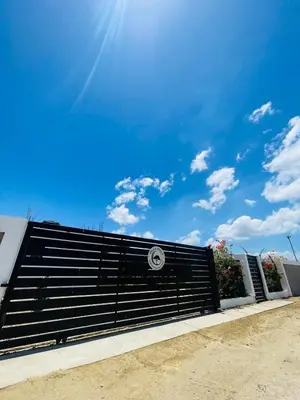 a black metal fence with a blue sky in the background at 2BR Getaway Villa in Montecristi in San Fernando de Monte Cristi