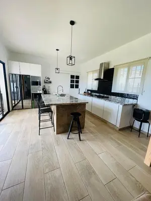a kitchen with a large island in the middle at 2BR Getaway Villa in Montecristi in San Fernando de Monte Cristi
