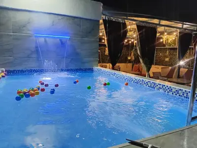 a swimming pool with balls in the water at Villa Medrano Home in Punta Cana
