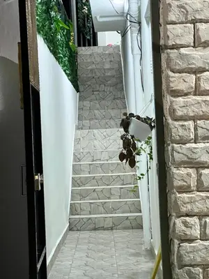 a stairway leading up to a building with stone stairs at Villa Medrano Home in Punta Cana