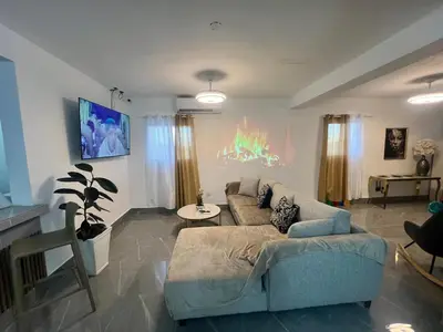 a living room with a couch and a table at Villa Medrano Home in Punta Cana