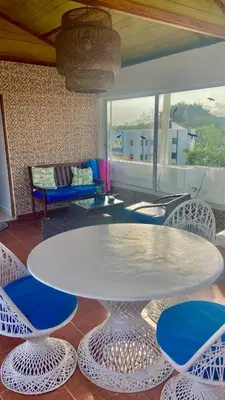 a living room with a white table and chairs at Sea Near and Beach a few minutes walking Top Location by RHV Living in San Felipe de Puerto Plata