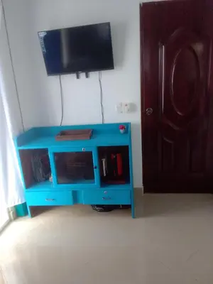 a blue tv stand in front of a door at Villa del mar in Bayahibe