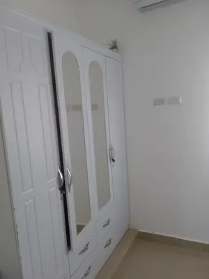 a bathroom with white cabinets and a mirror at Villa del mar in Bayahibe