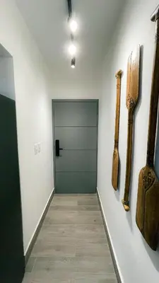 a hallway with a door in a room at Modern, Comfortable, Close to Beaches in Colorado