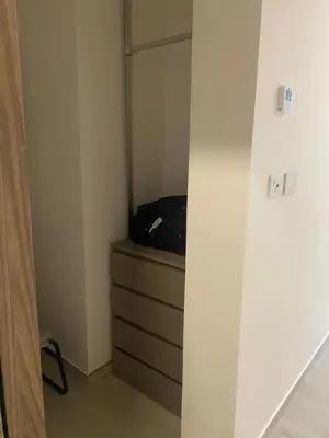 a room with a dresser with a tv in it at Playa Matilde, apartamento de lujo in Punta Cana