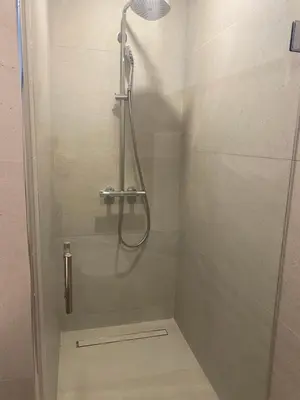 a shower in a bathroom with a glass door at Playa Matilde, apartamento de lujo in Punta Cana
