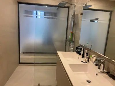 a bathroom with a glass shower and a sink at Playa Matilde, apartamento de lujo in Punta Cana