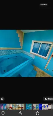 a picture of a swimming pool with a window at Bienvenue chez soi in Boca Chica