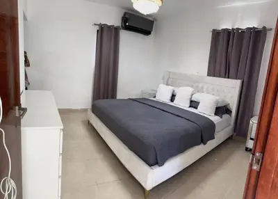 a bedroom with a bed with two pillows at Hermosa villa familiar in Colorado