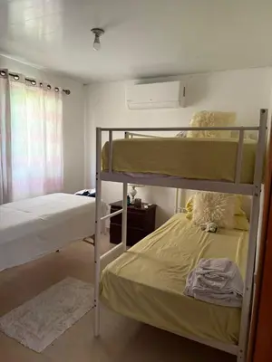 a bedroom with two bunk beds and a window at Hermosa villa familiar in Colorado