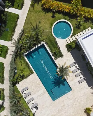 an overhead view of a swimming pool and a resort at Villa Padierna, Elegant Beach House Getaway in White Sands in Punta Cana