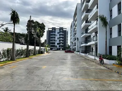 an empty parking lot in a city with buildings at Residenza in Santiago de los Caballeros