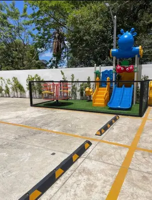 a playground with a play equipment in a park at Residenza in Santiago de los Caballeros