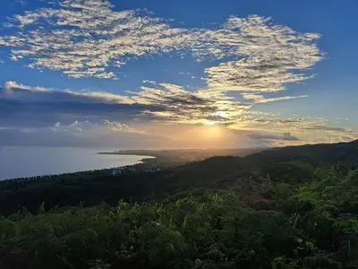 a view of the sun setting over the ocean at Beach Bungalow 100 m Playa Coson in Las Terrenas