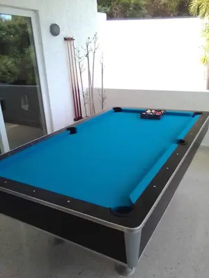a pool table with a blue cloth on it at Casa Jobo Scenic ViewsPrivate Pool TablePool in San Felipe de Puerto Plata