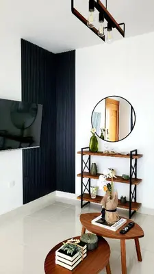a living room with a table and a mirror at Backup Power 2BR 2BA AC WiFi Gym 24h Security Ideal for long stays in Santiago de los Caballeros