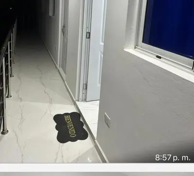 a black shoe sitting on the floor in a hallway at Casi de Aleyda in Las Terrenas