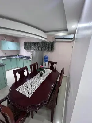 a dining room table and chairs in a room at Villa las Terrazas in Cabayona