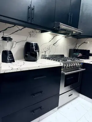 a kitchen with a stove and a blender on the counter at Tropical Escape Villa in Puerto Plata
